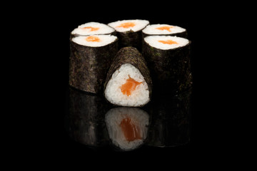 various sushi, rolls on a black background with reflection. especially for cafes and restaurants