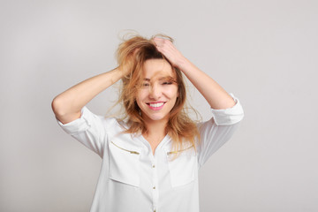 Fototapeta premium Enjoy life to fullest. Woman playing with her hair