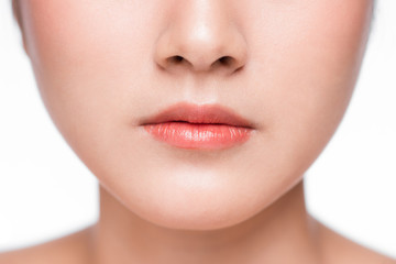 Obraz na płótnie Canvas Young asian woman close up. Perfect natural lip makeup
