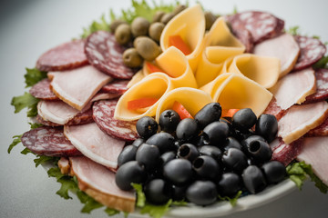 Sausage slicing. Sausage, ham, meat. Festive table.