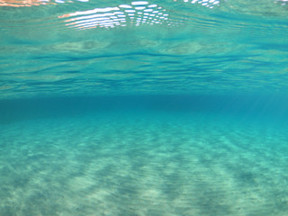 Underwater photo of super paradise beach with turquoise clear sea located in Greek island of Mykonos, Cyclades, Greece