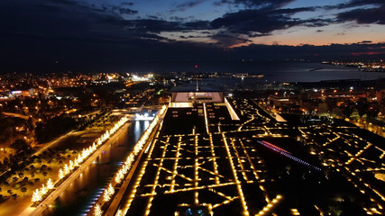 Aerial drone night shot of iconic public settlement of illuminated Stavros Niarchos Foundation and cultural centre during Christmas time, Faliro, Attica, Greece © aerial-drone