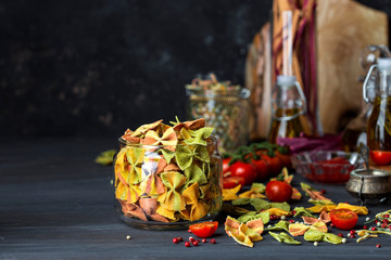 Mixed colorful farfalle pasta with vegetable mashed
