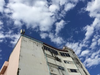 building with blue sky and clouds