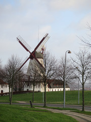 Obraz premium Windmill against grey winter clouds in Southern Denmark