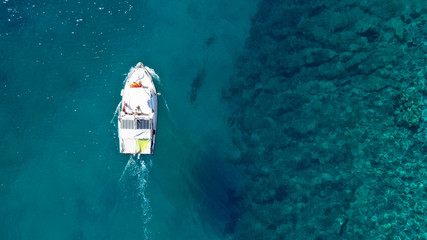Aerial drone photo of small boats docked in Greek island