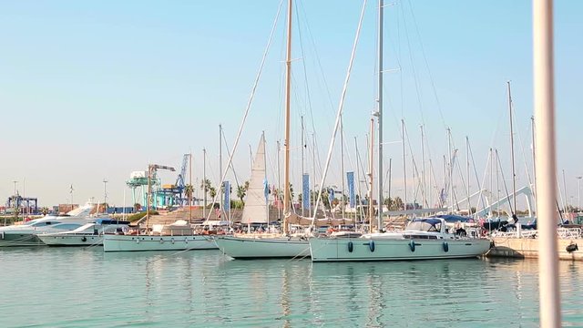 Yacht club Wonderful morning in the valence port. Yachts parked are rocking on waves. Sailboats are parked by the Sea Port