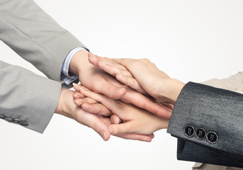 Obraz premium Concept of teamwork and unity with palms one on one in pile