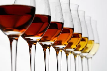 Fotobehang Row of cognac glasses with different stages of aging © niromaks