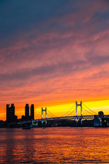 Naklejka premium Gwangan bridge and sea, twilight sunset view in Busan, Korea