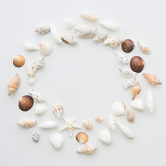 Frame from sea cockleshells and the stars. Round frame of sea shells. Copy space. Travel background.