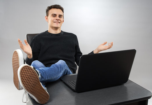 Young Man Putting His Feet Up