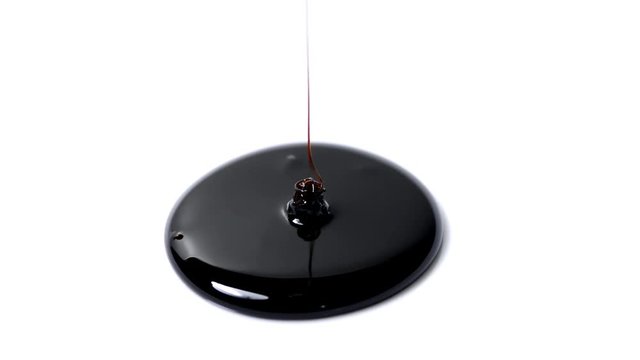 molassses flow on a white desk 
