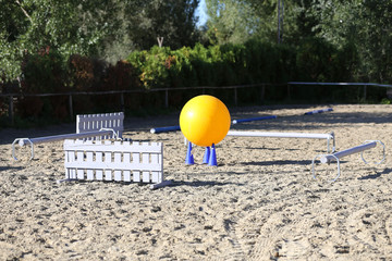 Colorful photo of equestrian obstacles. Empty field for horse jumping event competition