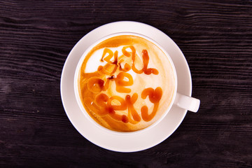 The drawing in a cup with kofy on a plate