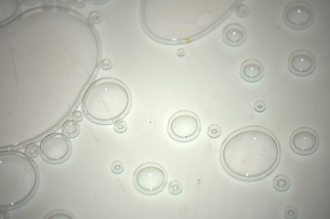 Air bubbles on gray transparent glass. Selective focus. For texture or background.
