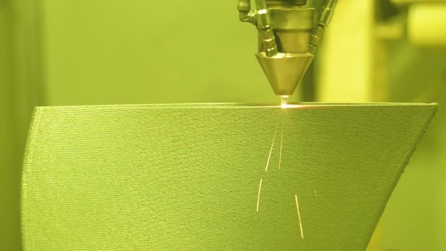 3D metal printer produces a steel part.