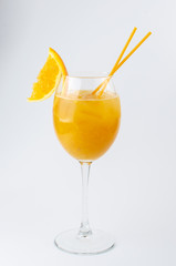 orange cocktail with orange slice on white background
