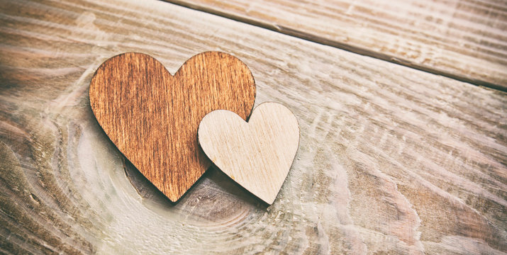 One wooden hearts on the wooden table