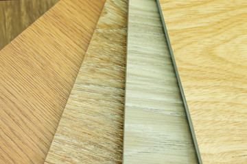 Obraz na płótnie Canvas Luxury vinyl flooring sample wood planks colors for new home ,copy space for text.