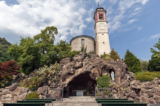 St. Georg Parish Church, below a replica of the Grotto of Lourdes, Mariengrotte, Cannero Riviera, Lago Maggiore, Verbano-Cusio-Ossola Province, Piedmont Region, Italy, Europe