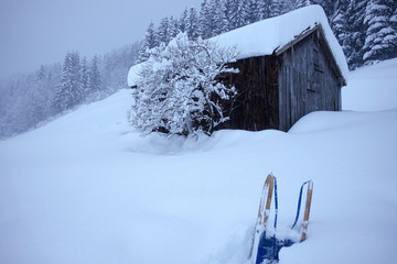 winter landscape with tree hut and sledge deep snow