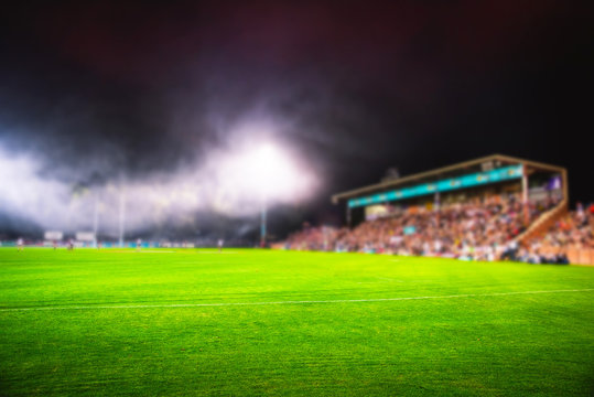 American Football Arena, Rugby. Blurred sport photo, edit space