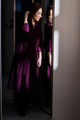 Charming portrait young woman wearing elegant evening dress. reflection mirror.Female lady fashion, beauty concept. Perfect beautiful girl face, classic style. hard light. Black background.