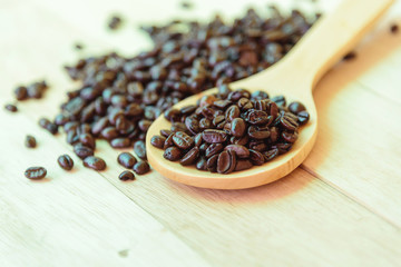 coffee bean on wood ladle