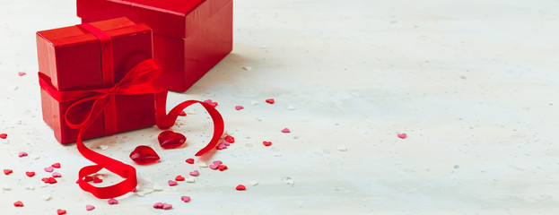 Gift box with red bow ribbon and heart