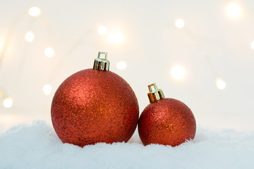 Christmas celebration with ball decoration on snow light bokeh background