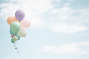 Group of soft pastel balloon with colorful on light blue sky. Concept of wedding, love, party and happy day. Use for background and greeting card.