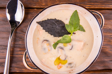 Seafood in seasonings and greens soup cream