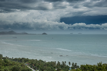 Dramatic stormy cloud sky above sea and small islands of Koh Samui island, Thailand in turquoise sea. Tropical Storm Pabuk.