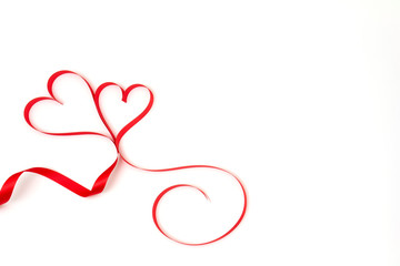 Couple red ribbon heart on white background and copy space. Love and Valentine's day concept.
