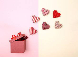 Pillow balloon hearts floating out of the gift box. Creative thinking about love and Valentine's day. Minimal style.