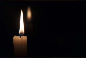 Candle flame on a dark background