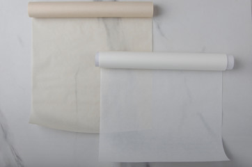 Two rolls of baking paper on the table