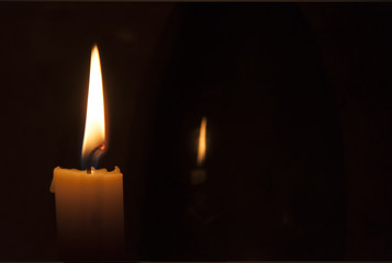 Candle flame on a dark background