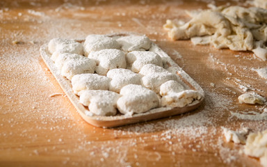 Raw homemade bread or donut in try on table.