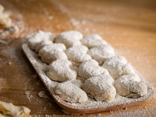 Raw homemade bread or donut in try on table.