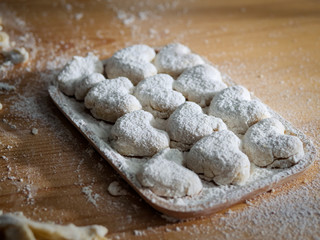 Raw homemade bread or donut in try on table.