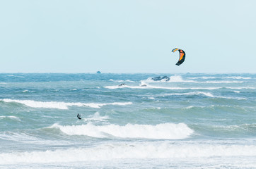 Kite surfing in big waves on windy weather