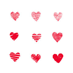 Set of red hand drawn textured vector hearts.