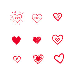 Set of red hand drawn textured vector hearts.