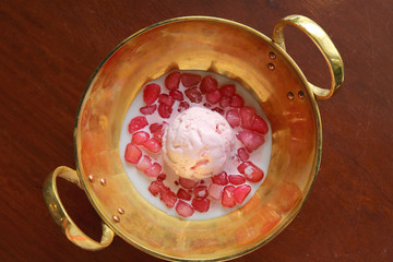 Top view of Tub Tim Grob (Tapioca flour coated chopped water chestnuts in coconut milk) served with ice cream 