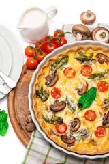 Baked homemade quiche pie in ceramic baking form