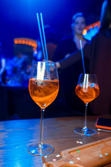 Bartender preparing alcoholic aperitif, aperol spritz cocktail