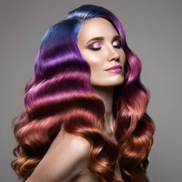 Portrait Of Beautiful Woman With Long Curly Colorful Hair