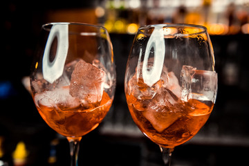 Bartender preparing alcoholic aperitif, aperol spritz cocktail